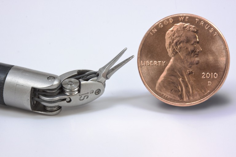 instrument_tip_size_comparison_with_US_penny_72